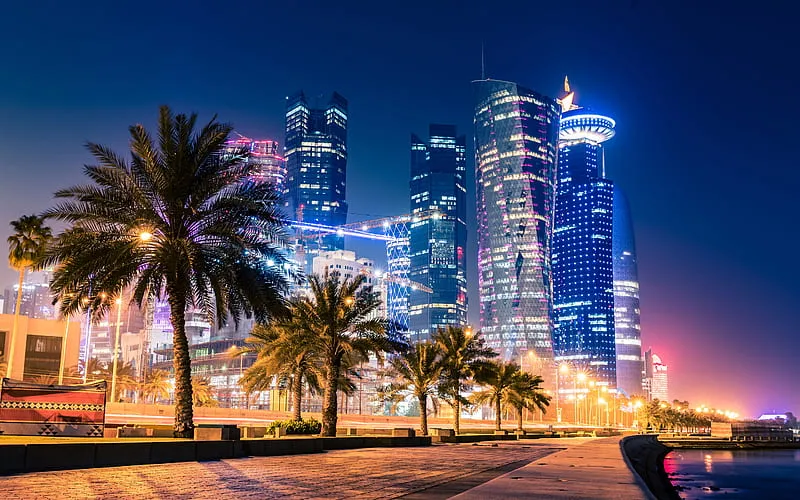 Doha skyline at night showcasing luxury hospitality growth in Qatar 2026