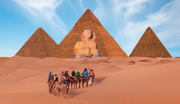 Tourists exploring Giza pyramids near Cairo combining heritage and modern travel experiences