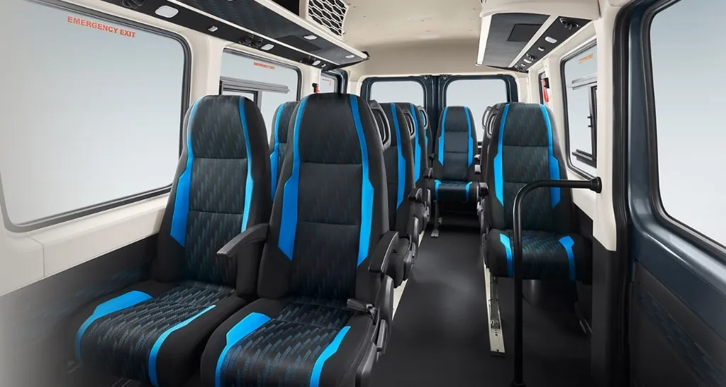 Tempo traveller interior seating layout showing comfortable reclining seats for group travel