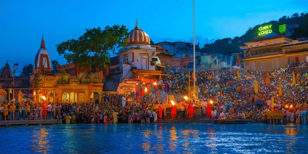 Devotees attending Ganga Aarti at Har Ki Pauri with diyas and fire ritual