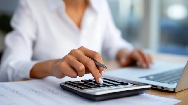 Corporate finance team reviewing GST invoices and travel expenses in office