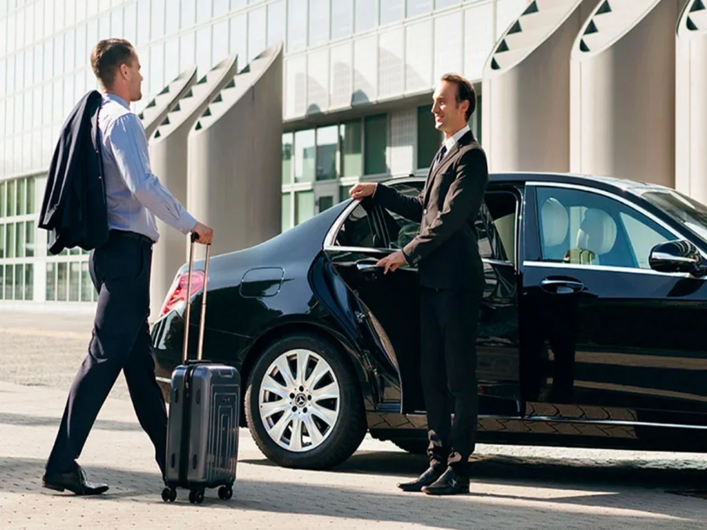 Corporate executive using chauffeur driven car service in Delhi NCR for business travel