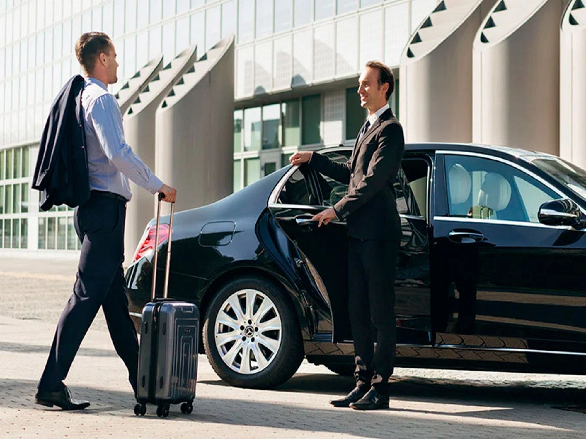 Corporate executive using chauffeur driven car service in Delhi NCR for business travel